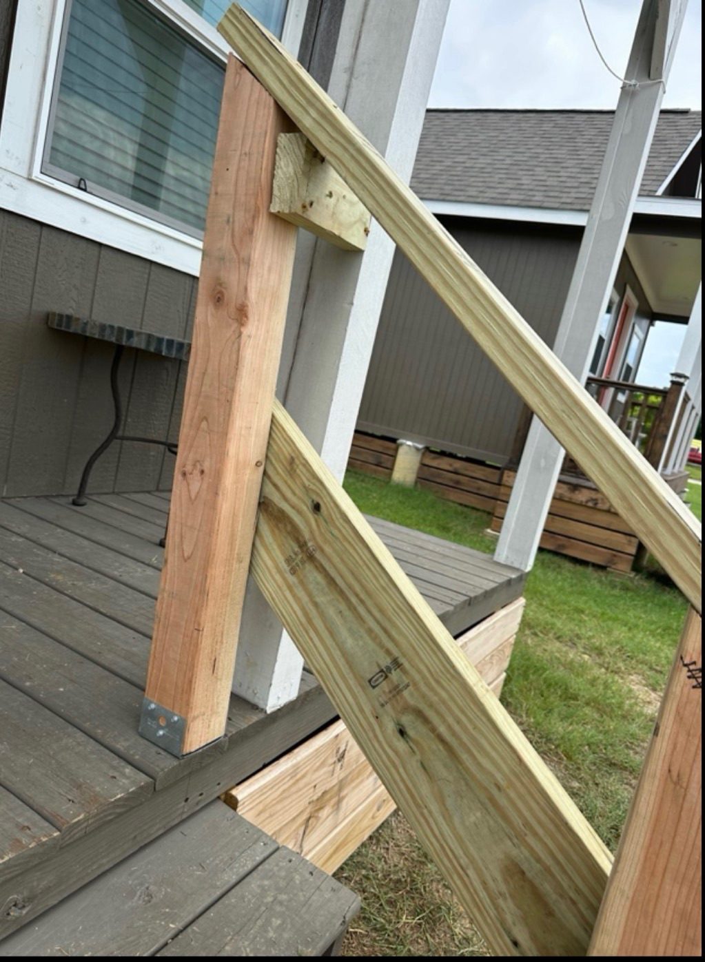 Framing a porch rail and step during a build day